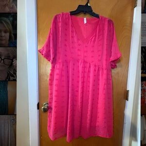 Woman’s pink knee length dress